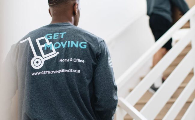 Image: Get Moving crew moving boxes for an office move.
